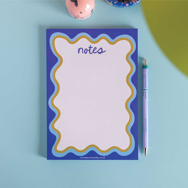a5 notepad with blue wavy border. recycled paper notepad. compact notepads.