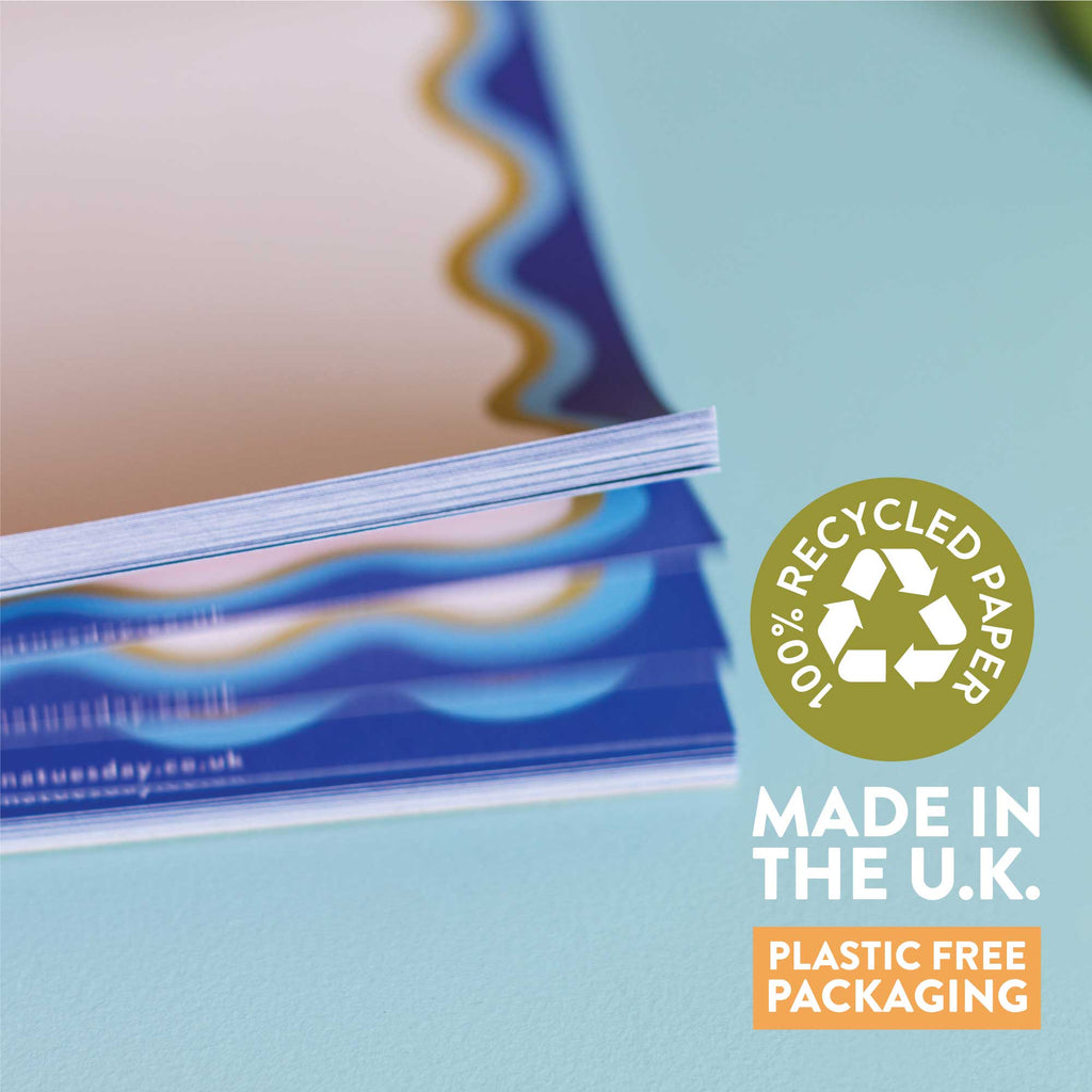 a5 notepad with blue wavy border. recycled paper notepad. compact notepads.