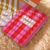 hot pink and cherry red striped notebook