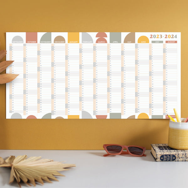 Academic 2023 - 2024 compact wall planner. Geometric shapes and muted colours. Made in the UK. 100% recycled paper.