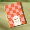 peach and cherry red checkered notebook