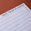 2024 wall planner. black and white. 100% recycled paper. made in the UK. highlighted weekends. week numbers. moon phases.