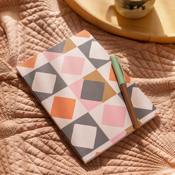 a5 lined notebook. 128 pages. lay flat. 100gsm 100% recycled paper. The cover design in inspired by modern quilting and beautiful tiles.