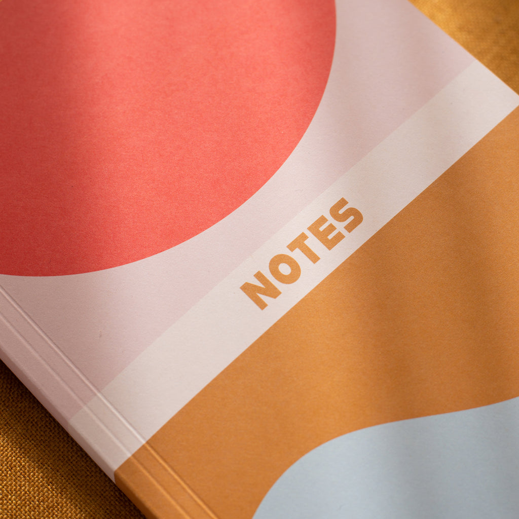 a5 lined notebook. 128 pages. lay flat. 100gsm 100% recycled paper. designed in a modern colour block design which borrows from retro styles.