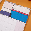 2024, A4 hanging wall calendar, the design is inspired by mondrian. 100% recycled paper. Made in the UK.