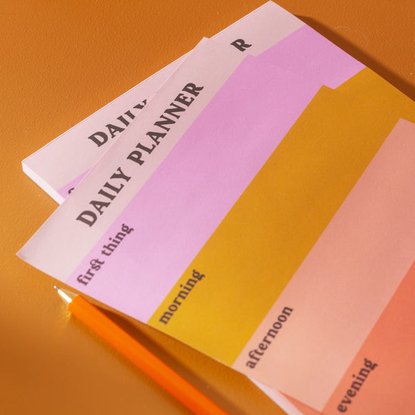 A5 Daily Planner Pad in Pastel Colour Block. This time blocking style desk pad helps organise your day with ease. 100% Recycled Paper. Made in the UK. ADHD daily planner.