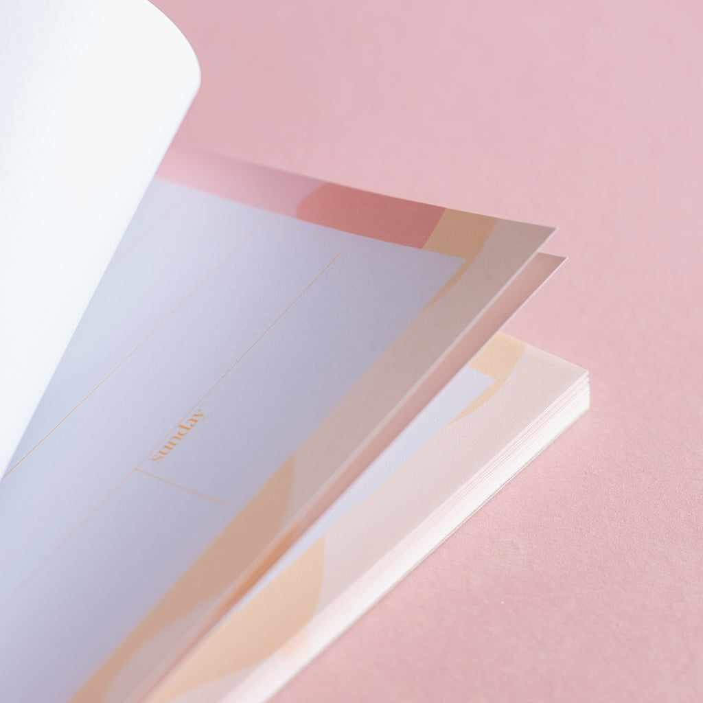 A5 weekly planner pad. sunrise. 100% recycled paper. Made in the UK.